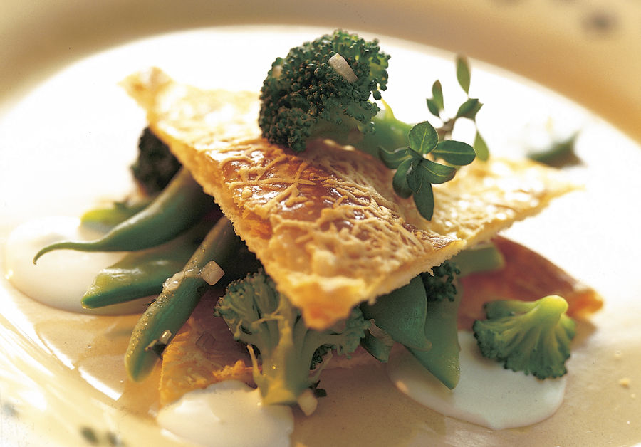 Sbrinz cheese feuilleté with  green vegetables and Schabziger cheese sauce