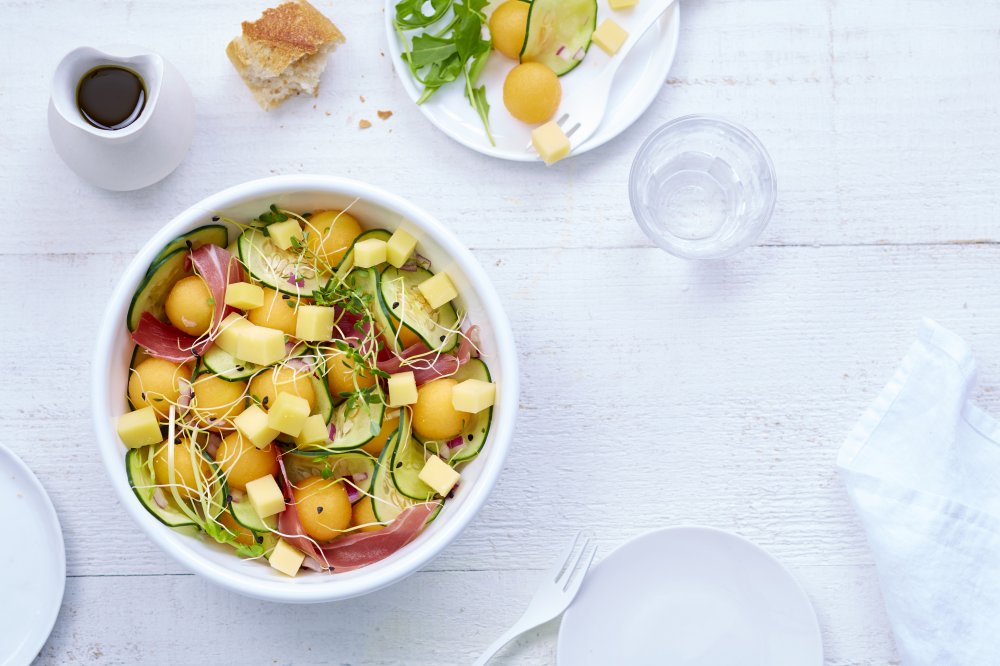 Summer salad with melon, ham, cucumber and Le Gruyère d’alpage AOP