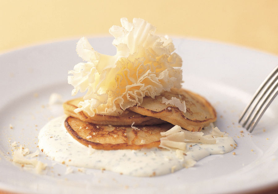 Potato pancakes with sour cream and herbs