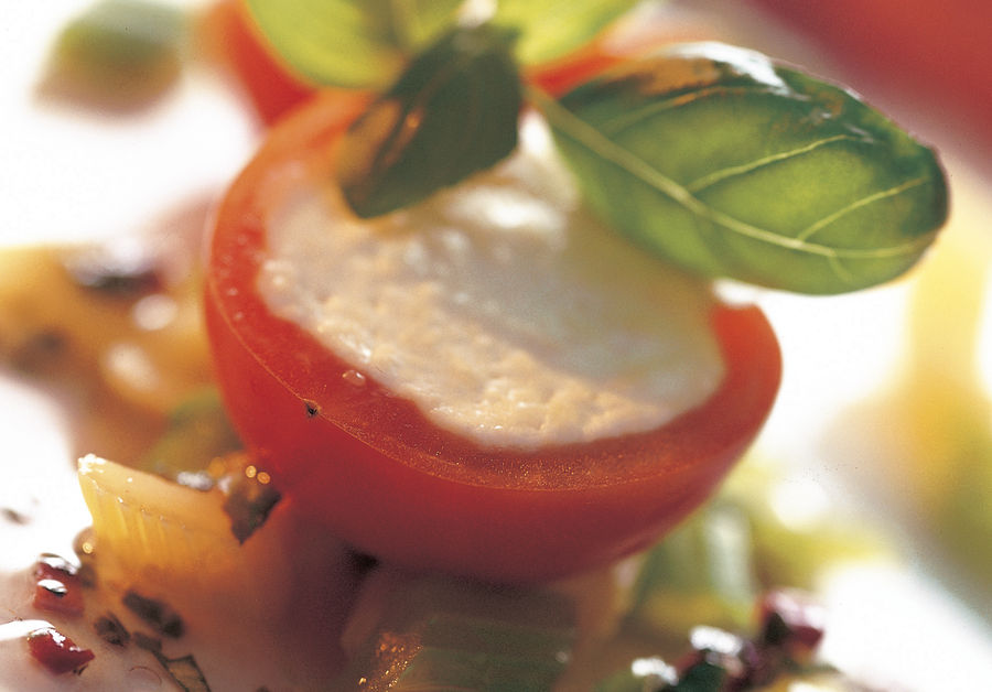 Tomatoes with Sbrinz AOP cheese filling and basil vinaigrette